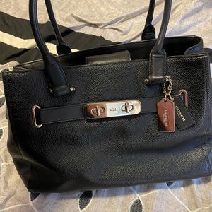 Authentic coach purse. Black leather with gold accents.